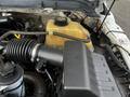 Close-up of the engine compartment of a 2016 Ford F-550 showing the air intake duct and coolant reservoir