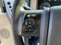 Steering wheel controls of a 2013 Ford F-450 SD with buttons for info setup and reset