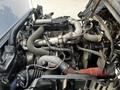 2020 Hino 195 engine with various components including hoses pipes and a turbocharger visible in a compact arrangement