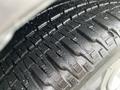 Close-up of a tire from a 2013 Toyota Sienna showing tread patterns and texture