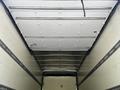 Interior view of a Hino 195 truck's cargo area featuring a high ceiling and white walls with metal strapping visible along the sides