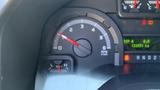 Gauge display of a 2013 Ford Econoline showing the RPM needle positioned just above the one mark with additional gauges and indicators visible