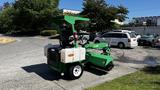 A 2017 Laymor SweepMaster 300 street sweeper in green with a raised operator canopy and a front-mounted broom attachment