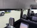 Interior view of a 2019 Mercedes-Benz Sprinter showcasing leather seats and a large window with a modern dashboard design