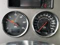 Dashboard of a 2014 Kenworth T370 displaying speedometer and tachometer gauges with indicators for RPM and mileage