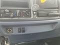 Dashboard controls of a 2008 Hino Conventional Cab including air conditioning knobs and various buttons for vehicle functions