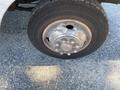 A close-up of a tire on a 2008 Ford Econoline showing the wheel rim and lug nuts