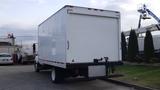 A 2012 International TerraStar box truck with a white cargo area and a black rear bumper