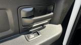 Interior door handle and window control panel of a 2019 RAM 3500