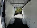Interior view of a 2022 Mercedes-Benz Sprinter cargo van showing a spacious, empty loading area with white walls and a black floor