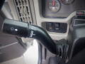 A close-up of the windshield wiper control lever in a 2008 International 7400 showing settings for off low and intermittent modes