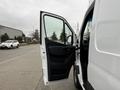 A 2019 Mercedes-Benz Sprinter van with the driver's side door open showcasing the interior and part of the dashboard