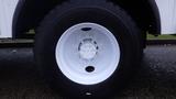 A close-up view of a white wheel on a 2005 International 4300 truck showcasing the tire tread and wheel design