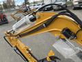 A close-up view of a yellow 2024 AGT Mini Excavator with a hydraulic arm featuring tubing and connectors