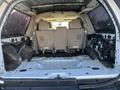 Interior of a 2013 Ford Expedition with empty rear cargo area and two rear seats visible