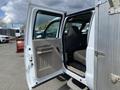 A 2010 Ford F-550 with the front passenger door open showing the interior and seat