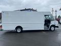 A white 2005 Freightliner MT45 Chassis box truck viewed from the side with a step entrance and no visible branding or markings