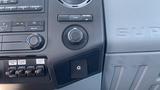 Dashboard controls of a 2011 Ford F-450 SD including climate controls and auxiliary switches