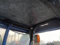 Interior view of the cabin roof of a 2007 New Holland TN70A tractor showing overhead structure and light fittings