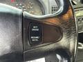 Steering wheel controls of a 2007 International 4200 featuring buttons for setting cruise control and resuming or accelerating