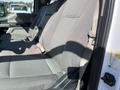 Front seats of a 2019 Ford F-350 SD with gray fabric upholstery and seat belts visible