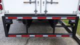 Rear view of a 2016 Hino 195 showcasing a black and red reinforced loading platform with industrial hooks and grips on the side