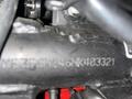 Close-up of a Royal Enfield Himalayan motorcycle part showing the engine number MEZ338N246K403321