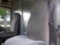 Interior view of a 2007 Morgan Olson Workhorse W42 featuring two gray fabric seats one with a seatbelt
