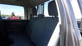 Interior view of a 2014 RAM 3500 showing the rear seats with grey upholstery and a spacious layout