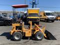 A yellow 2024 Traner TR 45 mini loader with a front bucket and a red canopy sitting on four wheels