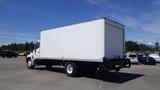 A 2009 Hino 268 box truck with a white cargo area and a single rear wheel on each side