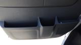 The interior door panel of a 2012 GMC Savana featuring multiple storage compartments designed for convenience and accessibility