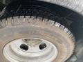 A close-up of a 2017 Chevrolet Express tire showing the tread pattern and the size specifications LT225/75R16