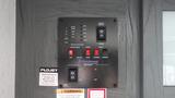 Control panel for a 2022 Aspen Trail camper featuring switches for water pump gas electric awning and slide rooms