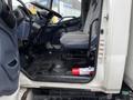 Interior view of a 2008 Hino Conventional Cab showing the driver's seat dashboard and floor space with a red fire extinguisher in the corner