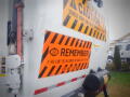 A 2008 International 7400 truck with caution signage on the side warning to stay back if you can't see the driver