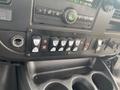 Dashboard controls of a 2017 Chevrolet Express featuring multiple buttons and switches for various vehicle functions