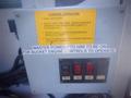 A control panel for a 2006 Freightliner FS65 featuring buttons for power and equipment functionality with warning labels regarding operation requirements