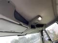 Interior ceiling of a 2018 International 26 Foot Cube vehicle showing overhead storage mesh and a light fixture