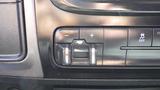 Control panel of a 2014 RAM 3500 featuring buttons for adjusting settings with symbols indicating functions