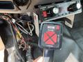 Dashboard of a 2010 Ford F-550 featuring a control panel with a power switch and a Western brand control joystick for raising and lowering a snowplow