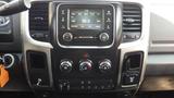 Dashboard of a 2014 RAM 5500 featuring a radio display air conditioning controls and various knobs and buttons for vehicle settings