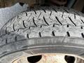 Close-up of a worn tire on a 2010 Ford F-550 showing visible tread wear and cracks on the rubber surface