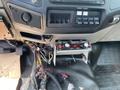 The interior controls of a 2010 Ford F-550 including switches for auxiliary power and wiring connected to the control panel