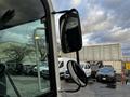 A close-up view of the side mirror of a 2007 Tennant Sentinel showing two mirrors mounted on a black arm