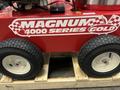 A 2024 Magnum 4000 Hot Water Pressure Washer featuring a red exterior with "MAGNUM 4000 SERIES GOLD" branding and large black wheels