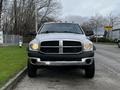 A 2008 Dodge Ram 5500 with a silver body black front grille and visible headlights is parked on the side of the road