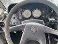 The interior dashboard of a 2005 Freightliner MT45 Chassis featuring two large gauges three buttons and a steering wheel with the Freightliner logo