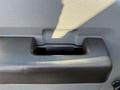 Close-up of the door handle on a 2016 Ford F-350 SD with a textured surface and a rectangular opening for pulling the door open