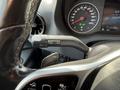 Close-up view of the steering wheel and dashboard of a 2019 Mercedes-Benz Sprinter displaying speedometer and gear controls